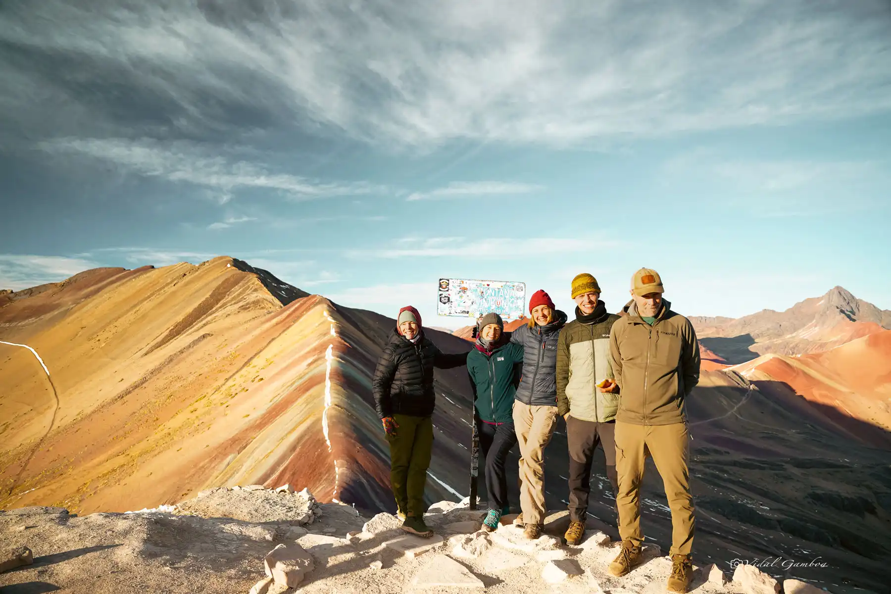 Happy group in Vinicunca Rainbow Mountain, Cusco